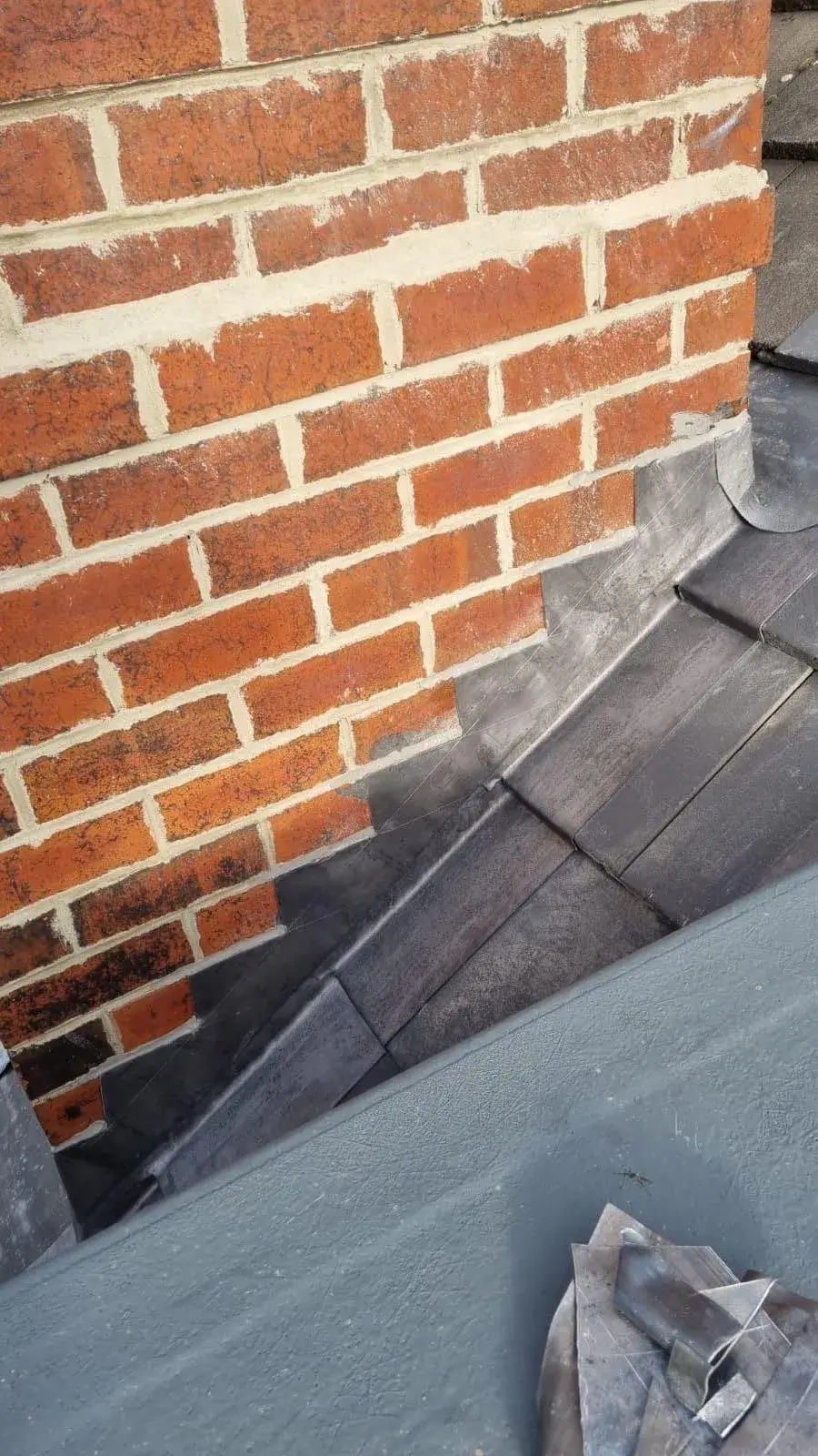 a brick wall with a piece of cloth on top of it