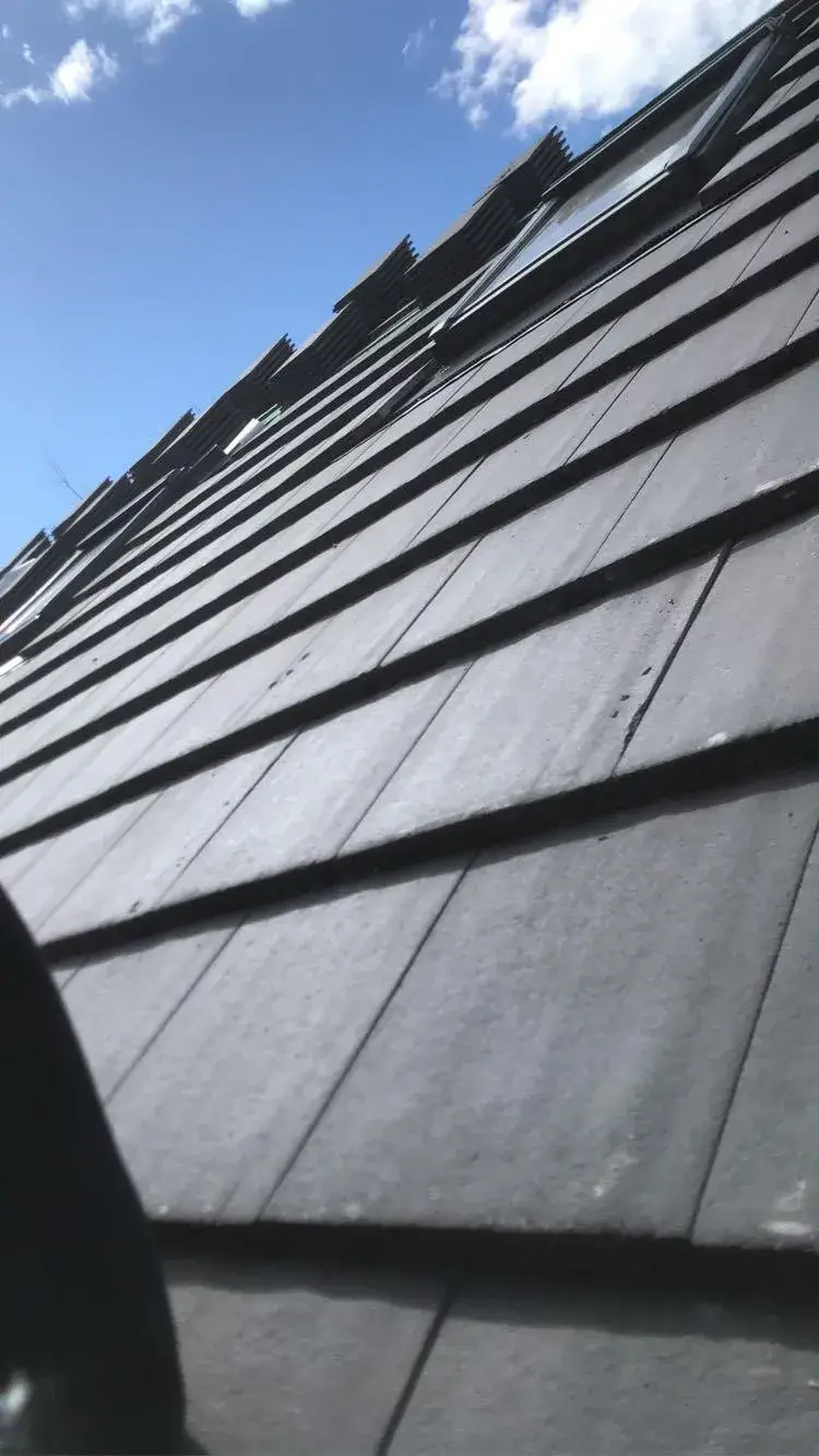 a close up of a roof with a sky background