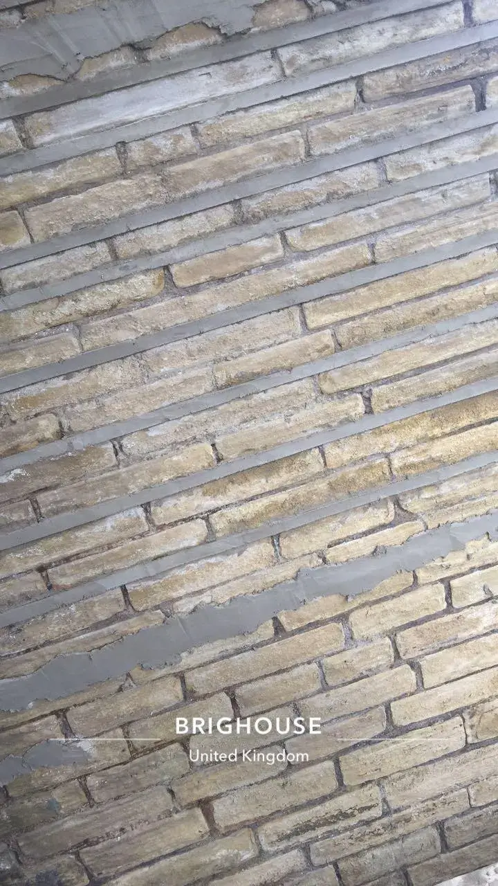 a brick wall that has been painted gold