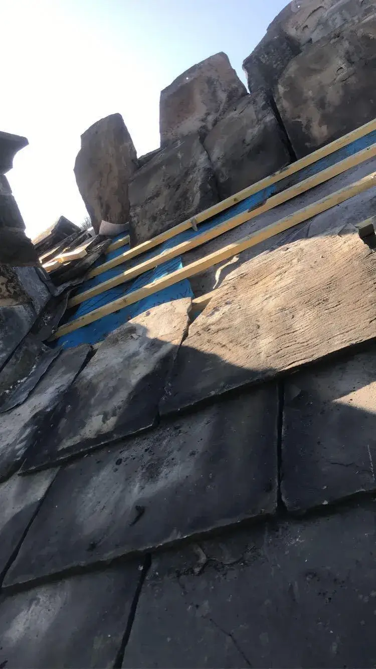 a pair of skis sitting on top of a roof
